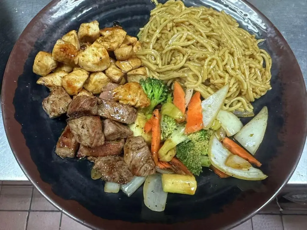 Hibachi-Express-&-Sushi-Japanese-restaurant-Chicken-Steak-Noodle-Bowl-Oklahoma City Stir - fried noodles with juicy chicken cubes, tender steak pieces at Hibachi Express & Sushi, a Japanese restaurant in Oklahoma City
